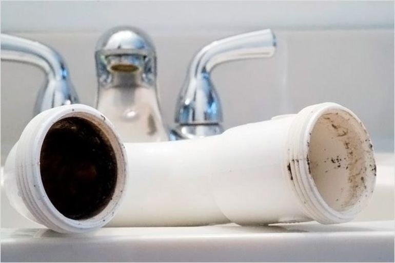 Bathroom sink clogged black sludge in pipes